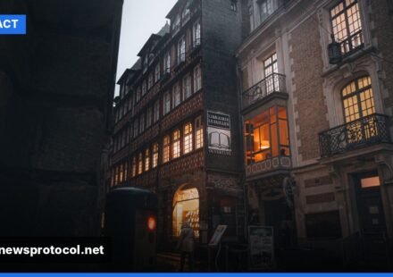 Closed French shop under curfew lights on a Paris street