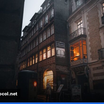 Closed French shop under curfew lights on a Paris street