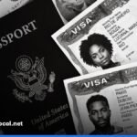 Passport, application forms and documents laid out on a desk for a UK visa application