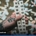 A close‑up of a Canadian Lotto Max ticket with numbers and a $6 price tag.