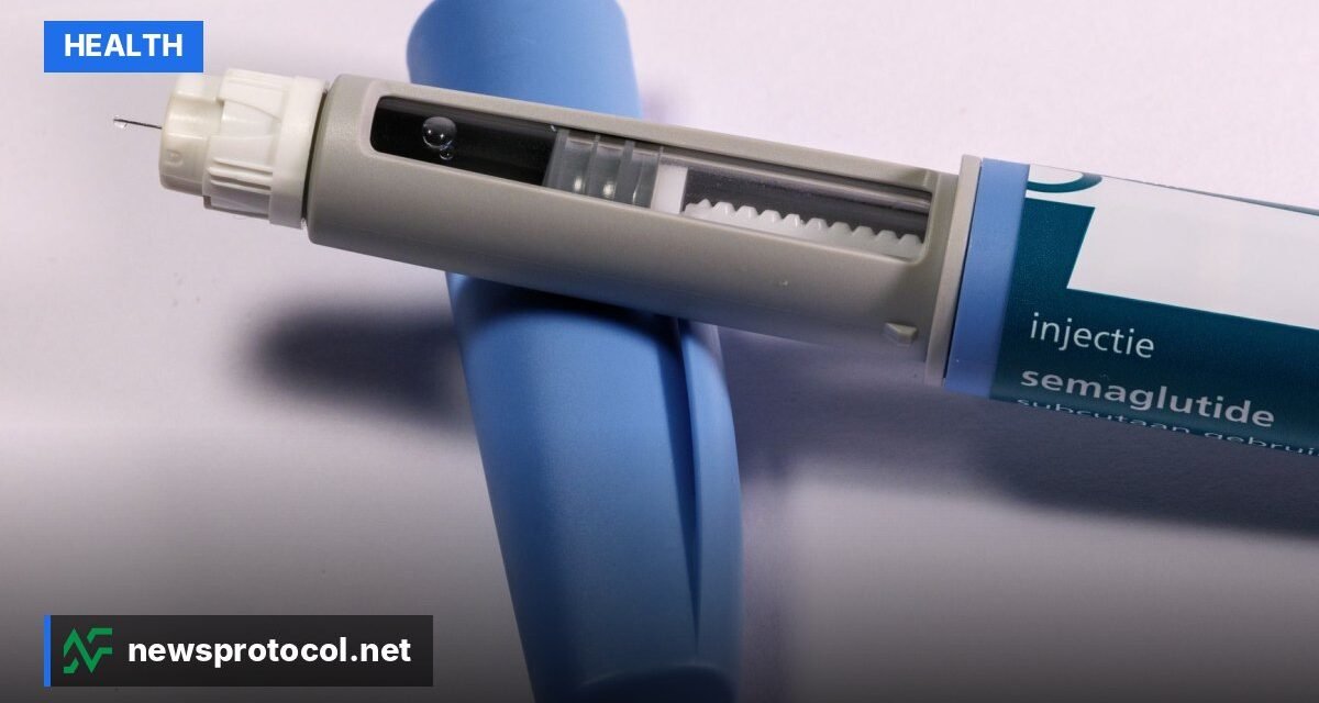 A weekly weight loss injection pen and its packaging on a plain clinical surface