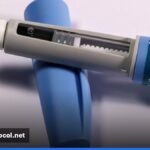 A weekly weight loss injection pen and its packaging on a plain clinical surface