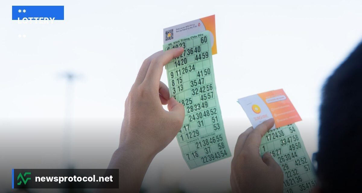 ** A close‑up of Lotto Max tickets and a glowing jackpot display at night. **