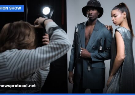 Models preparing backstage at a fashion show, adjusting outfits and makeup before walking the runway.